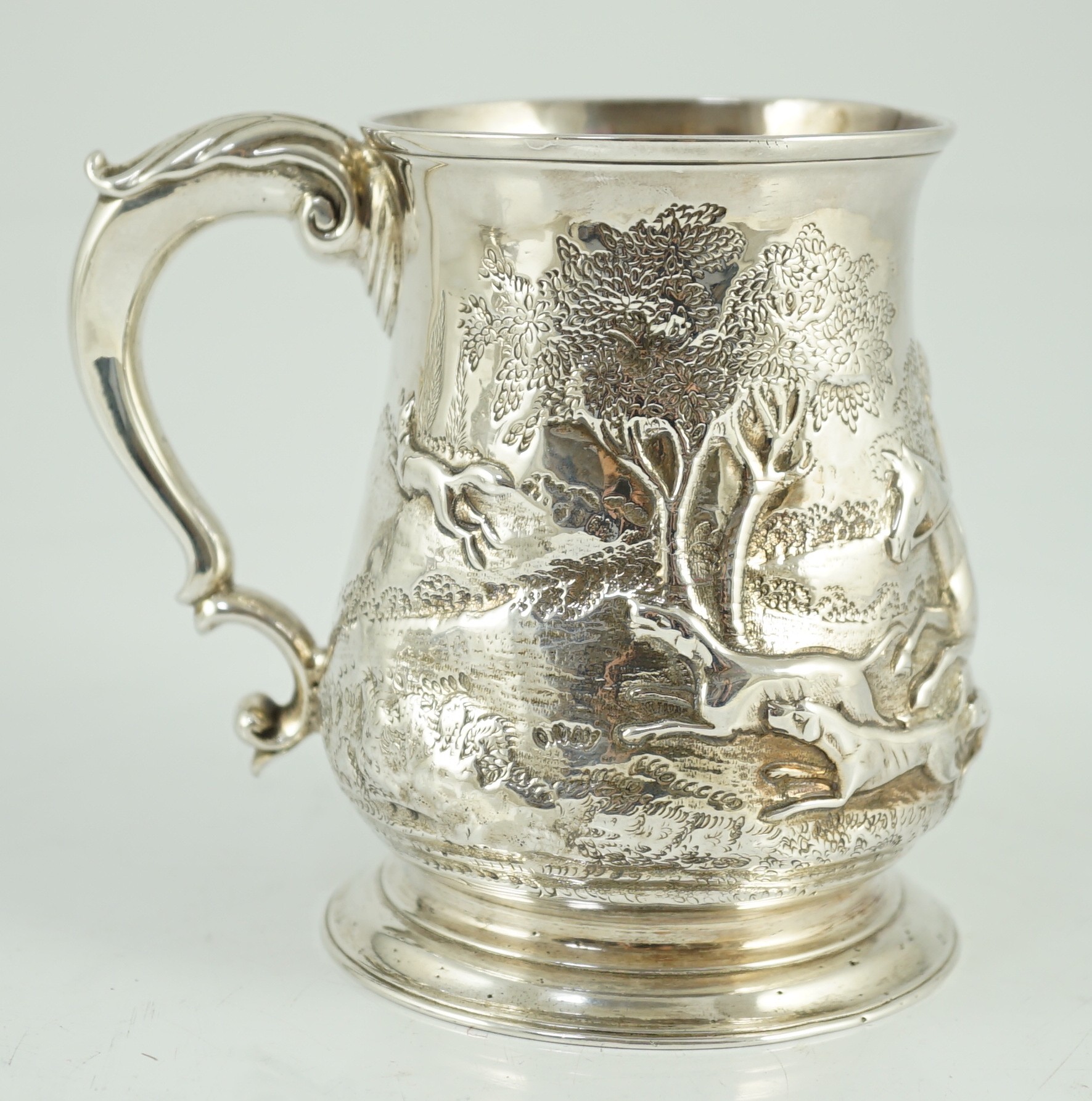 A George II silver baluster mug, later embossed with continuous hunting scene, Richard Gosling